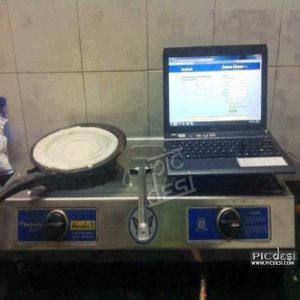 Facebook Addict Laptop in Kitchen